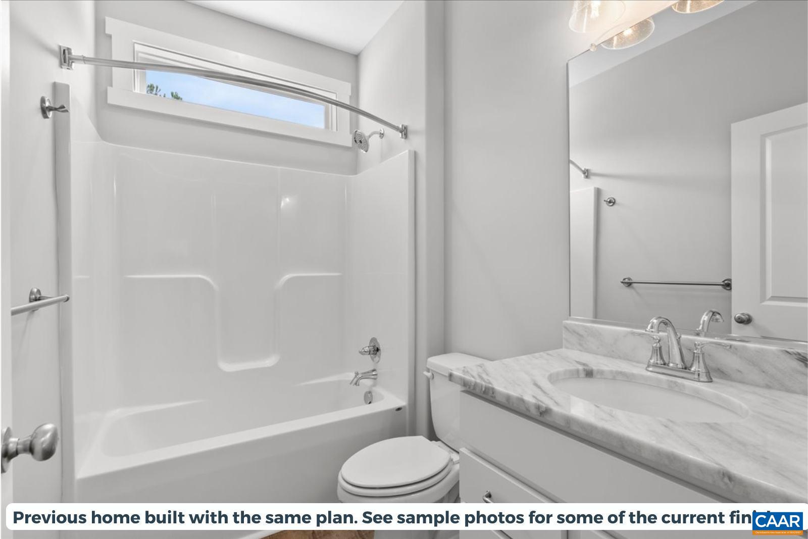 Lot A1 Patterson Road Buckingham, VA 23921 - Photo 20 of 23 a bathroom with a granite countertop sink a mirror and a bathtub