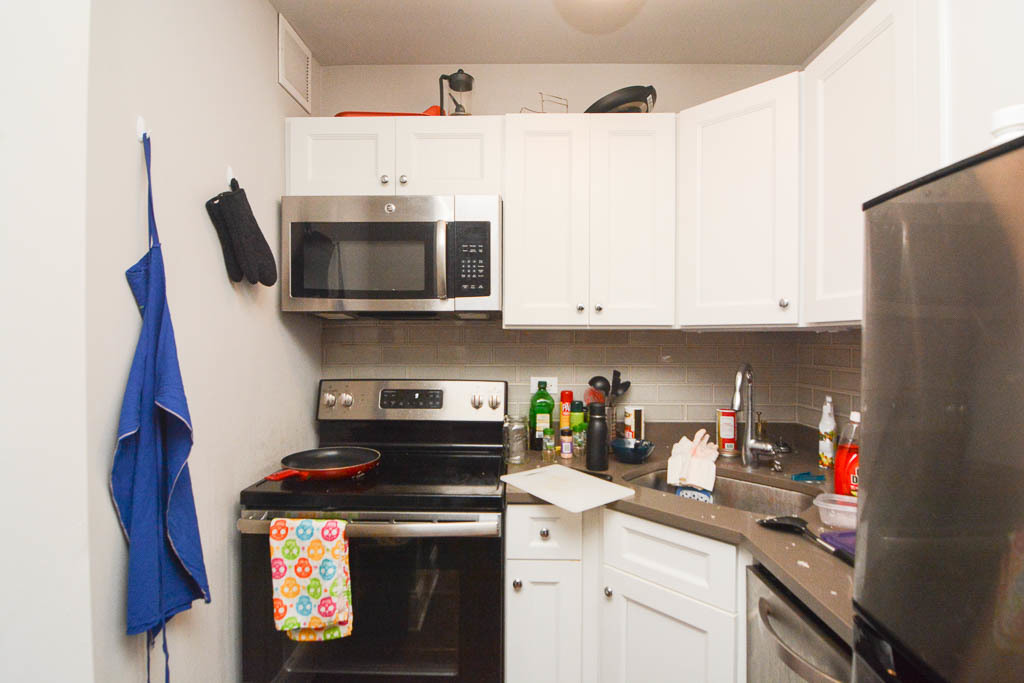 817 West Lakeside Place, Unit 408 Chicago, IL 60640 - Photo 3 of 17 a kitchen with stainless steel appliances granite countertop a stove a microwave and cabinets