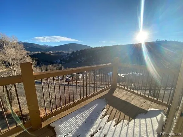 a view of balcony with wooden floor
