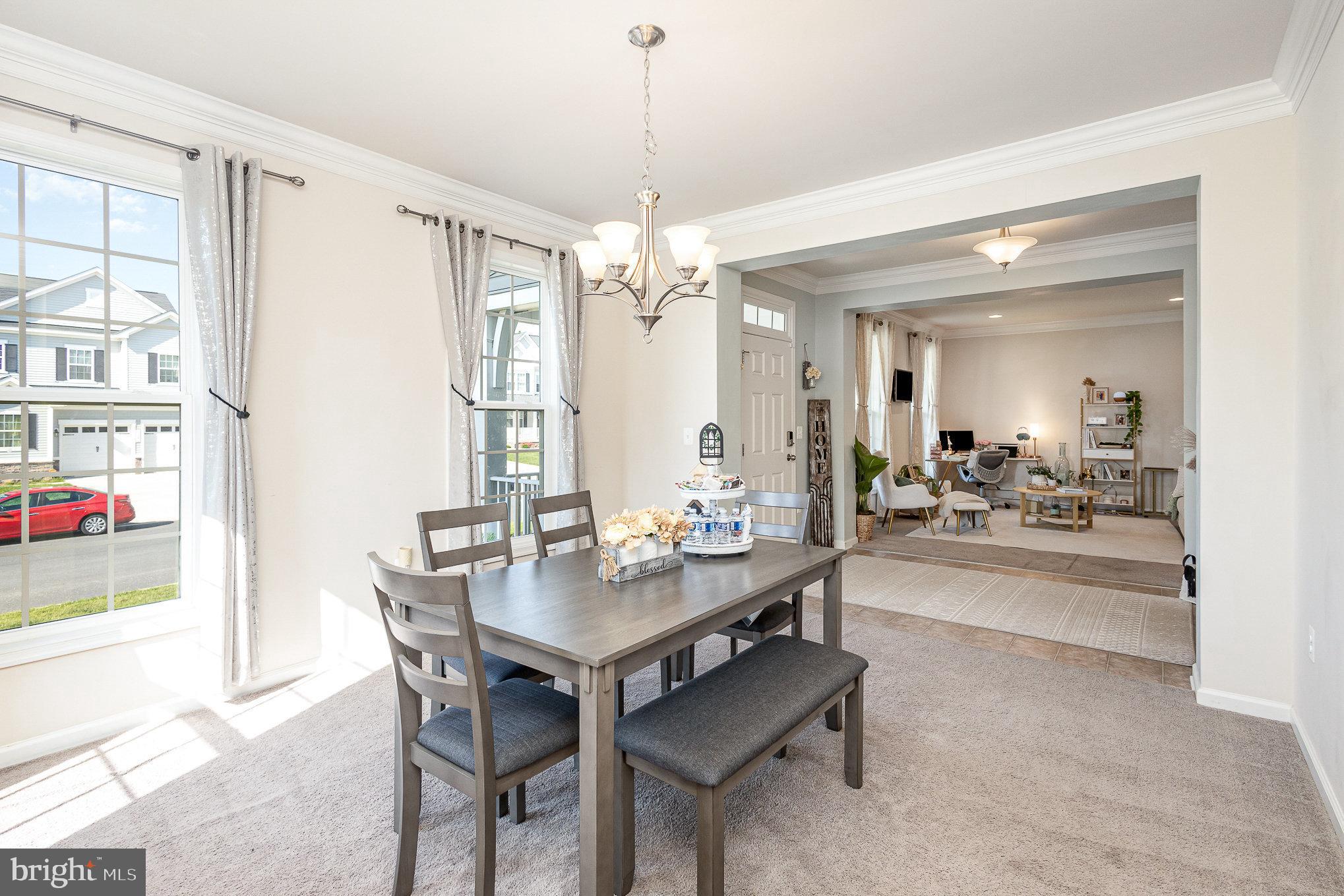 1040 Aspen Road Stafford, VA 22554 - Photo 16 of 51 a view of a dining room with furniture and chandelier
