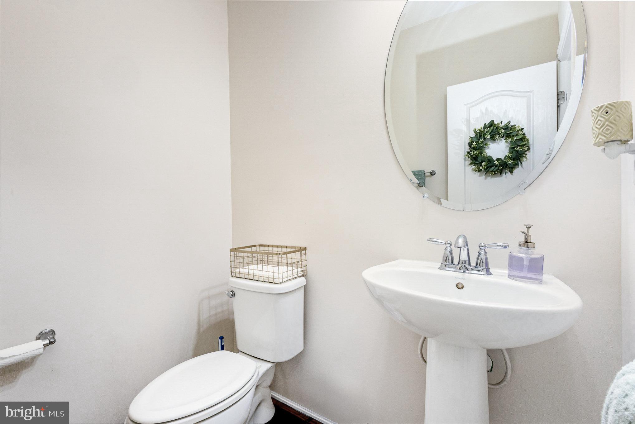 1040 Aspen Road Stafford, VA 22554 - Photo 20 of 51 a bathroom with a toilet sink and mirror