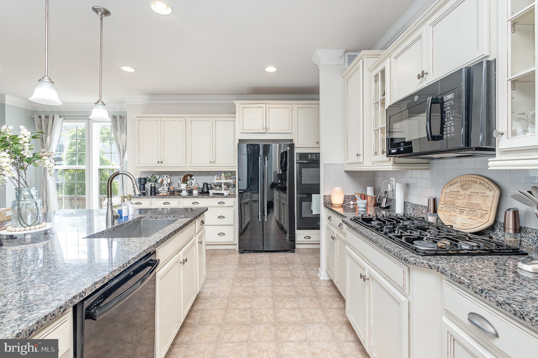 1040 Aspen Road Stafford, VA 22554 - Photo 21 of 51 a kitchen with a stove refrigerator and cabinets