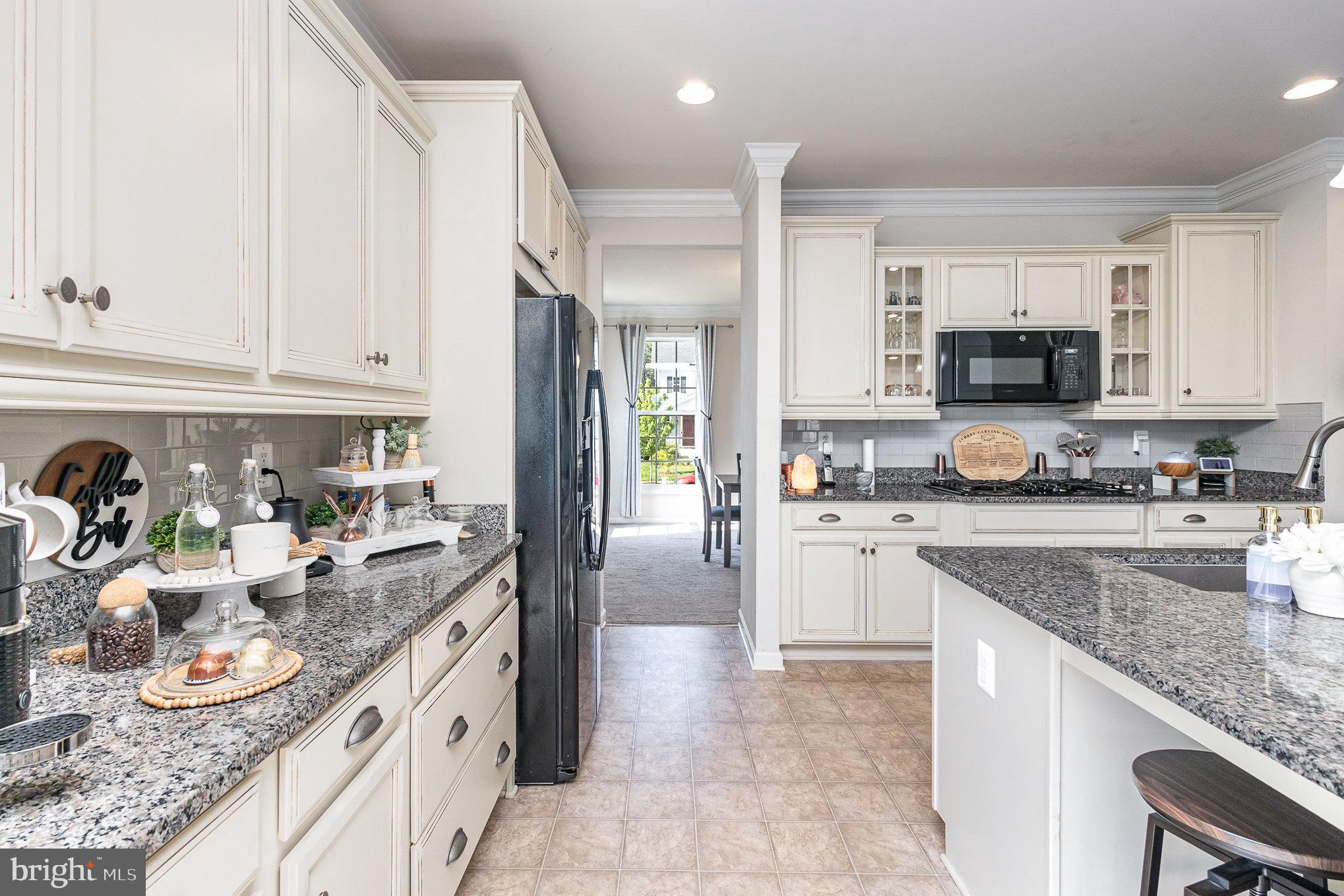 1040 Aspen Road Stafford, VA 22554 - Photo 22 of 51 a kitchen with granite countertop stainless steel appliances and white cabinets
