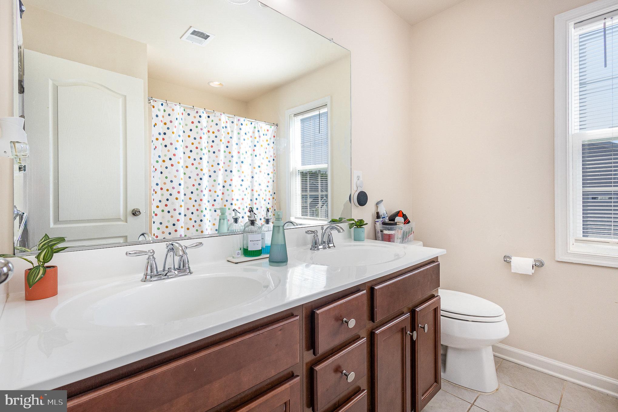 1040 Aspen Road Stafford, VA 22554 - Photo 29 of 51 a bathroom with a sink a toilet and a window