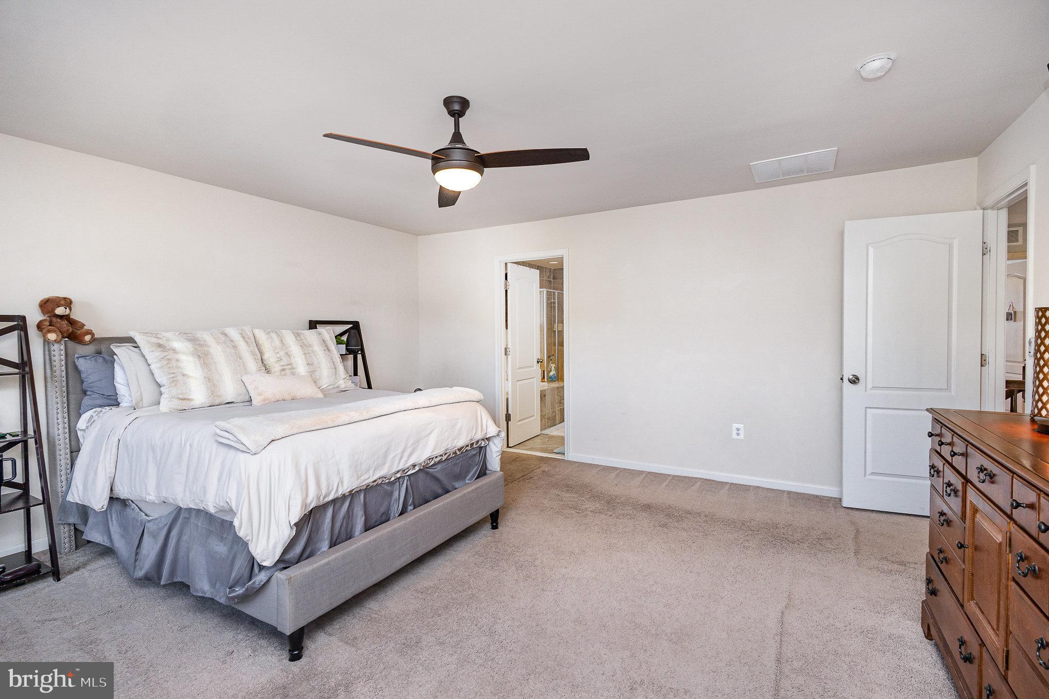 1040 Aspen Road Stafford, VA 22554 - Photo 35 of 51 a bedroom with a bed and a ceiling fan