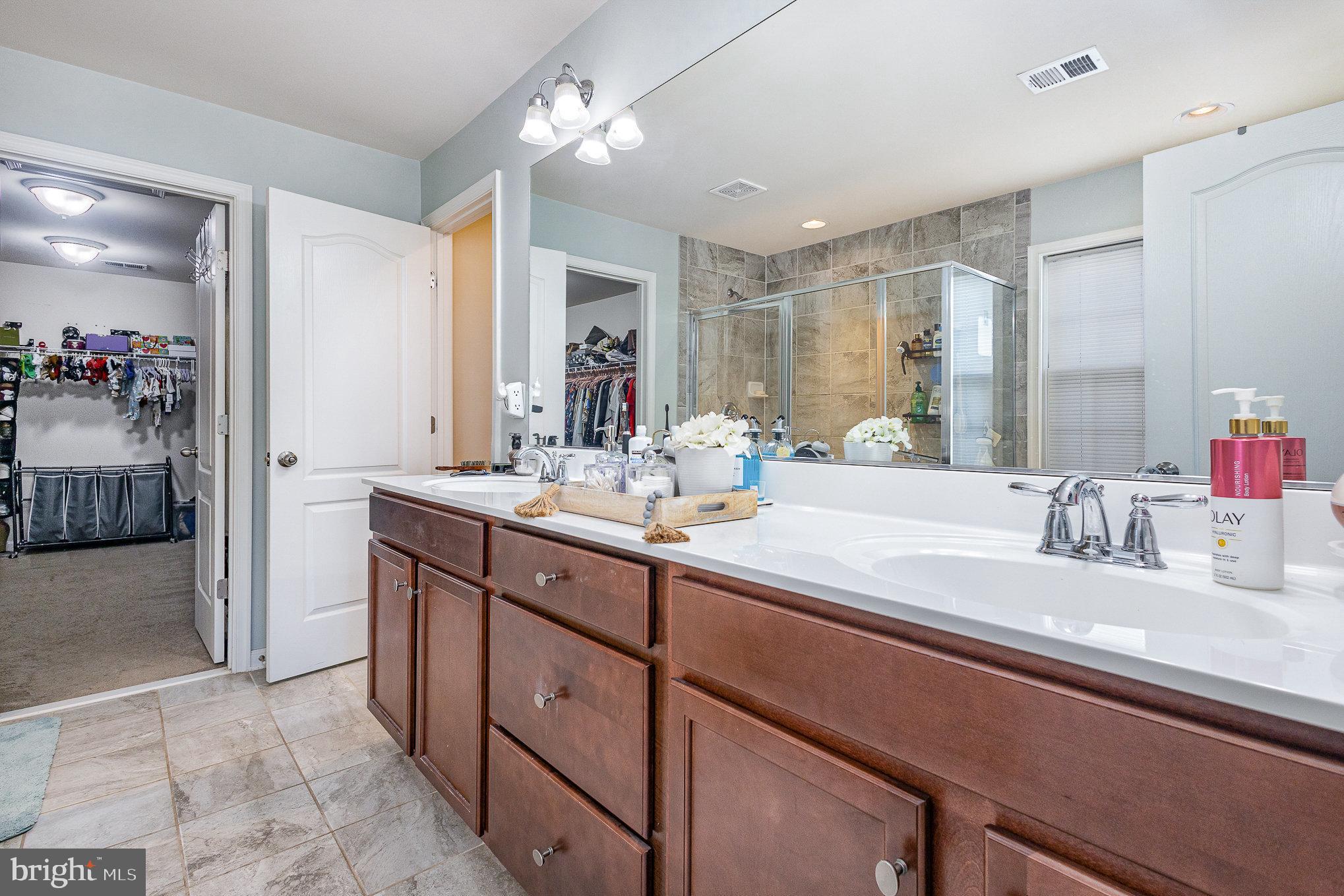 1040 Aspen Road Stafford, VA 22554 - Photo 36 of 51 a bathroom with a sink double vanity and a mirror