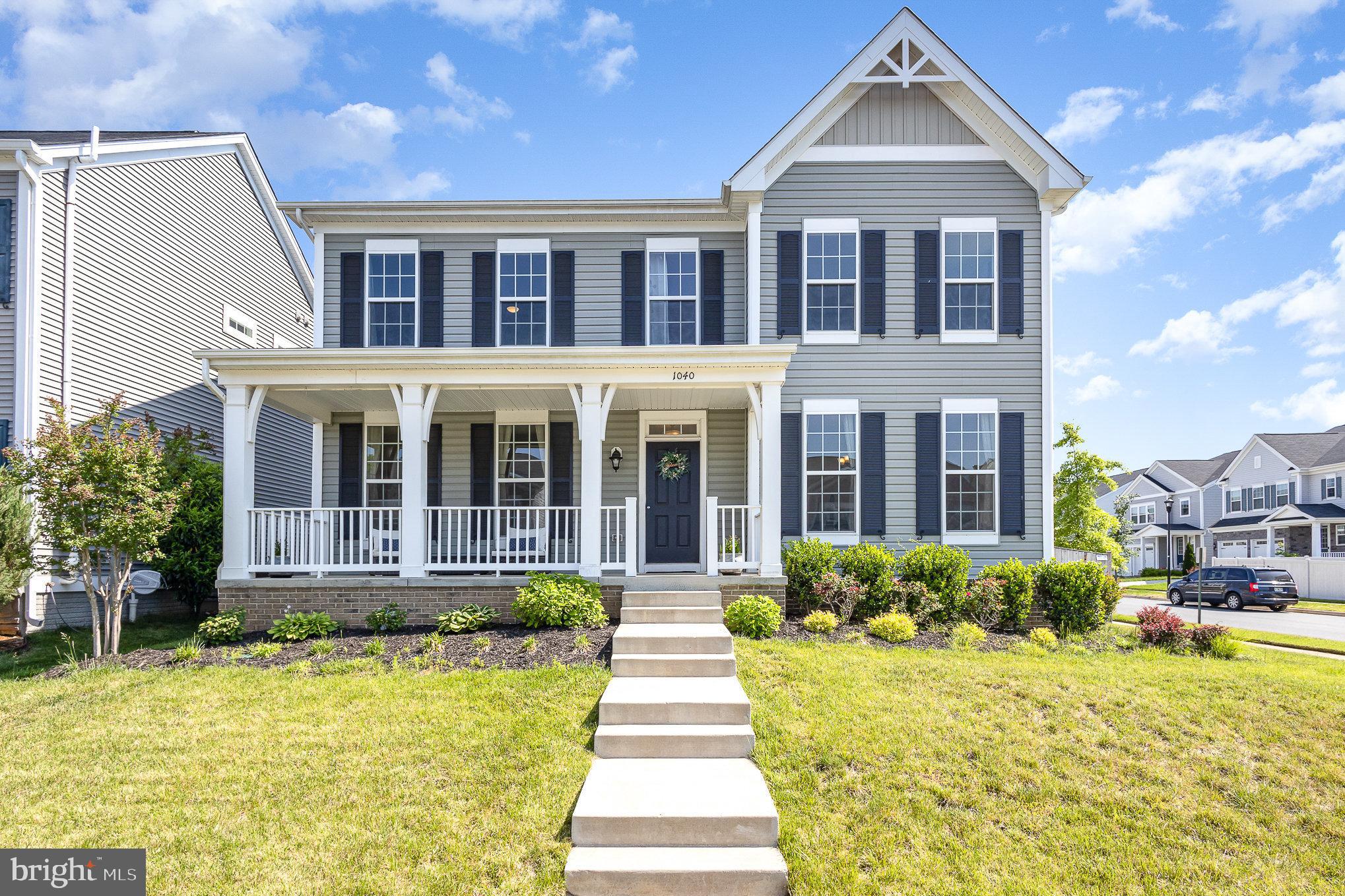 1040 Aspen Road Stafford, VA 22554 - Photo 4 of 51 a front view of a house with a yard