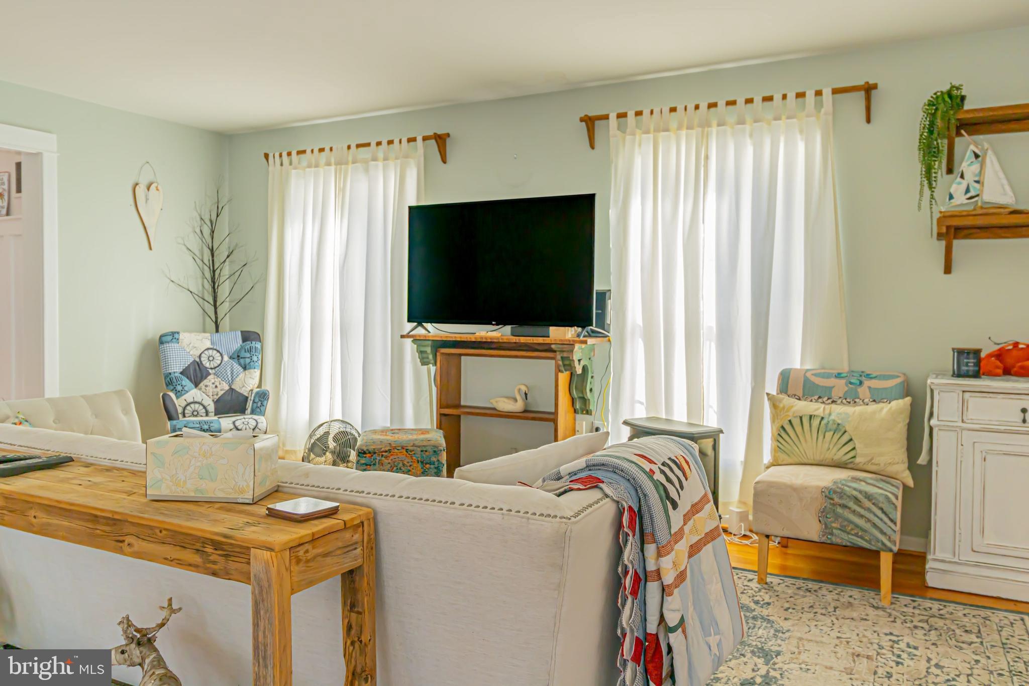 903 Oakdene Road Middle River, MD 21220 - Photo 17 of 47 a living room with furniture and a flat screen tv