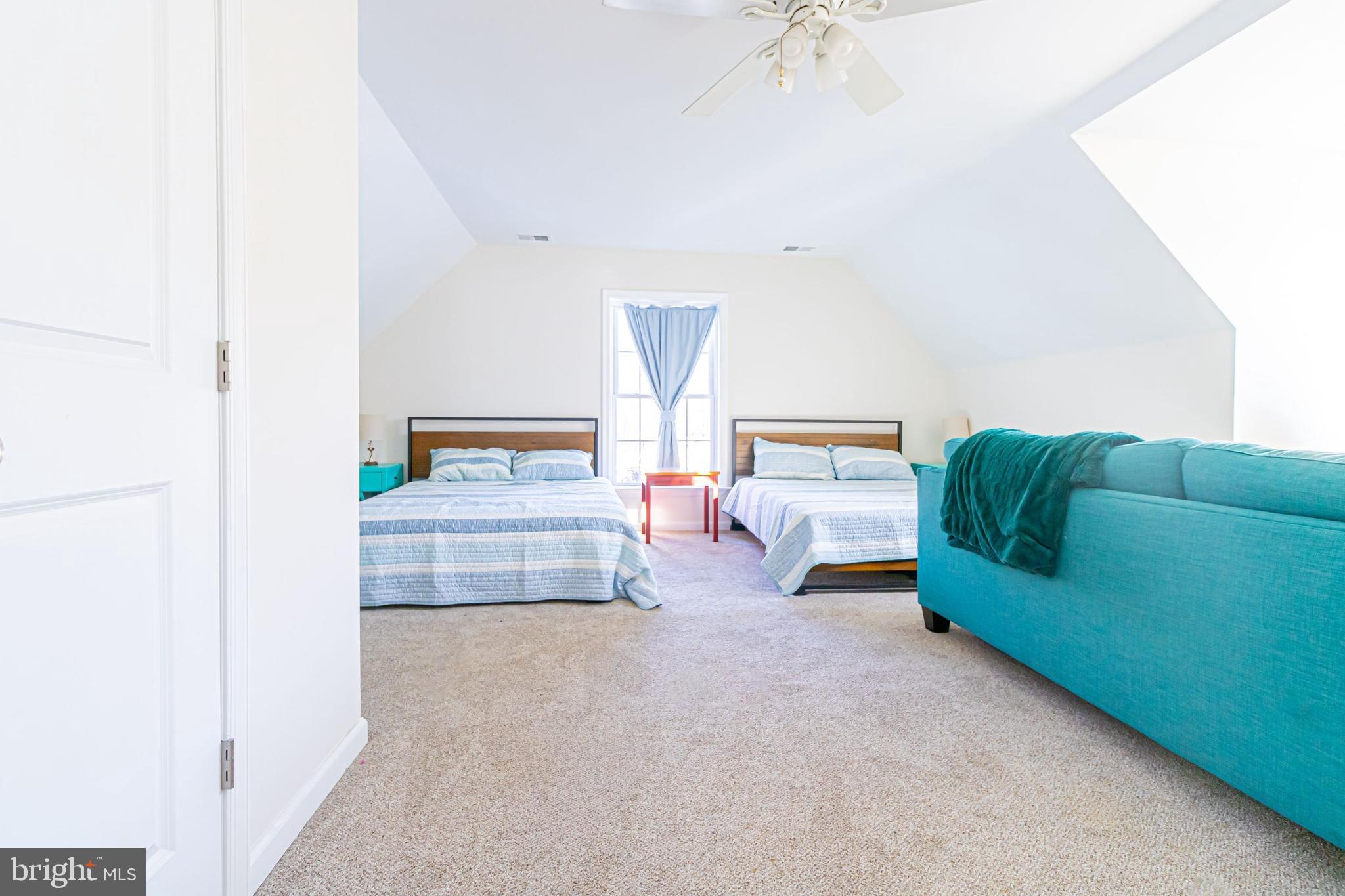 903 Oakdene Road Middle River, MD 21220 - Photo 33 of 47 a bedroom with a bed and a chandelier