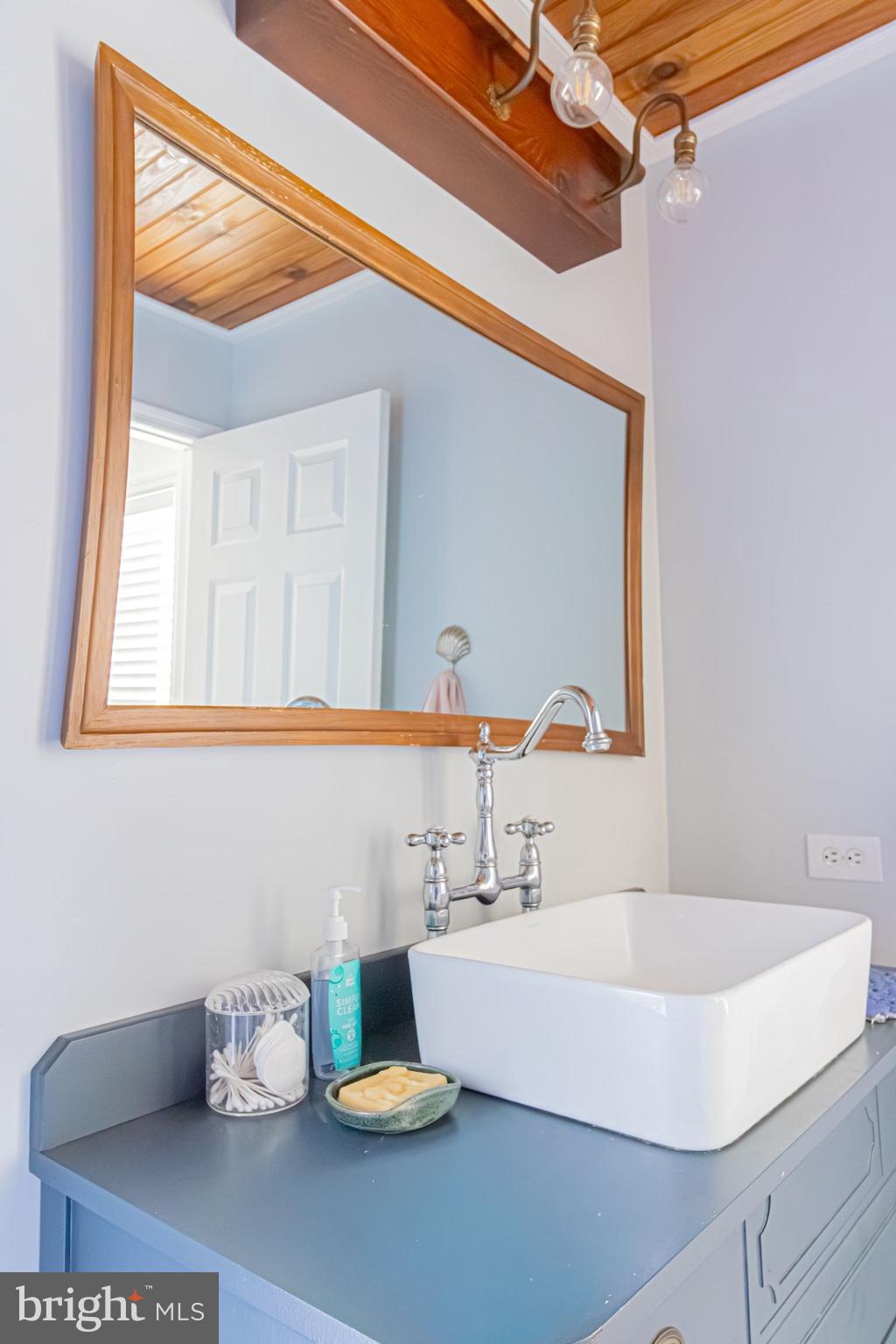 903 Oakdene Road Middle River, MD 21220 - Photo 34 of 47 a bathroom with a sink and a mirror