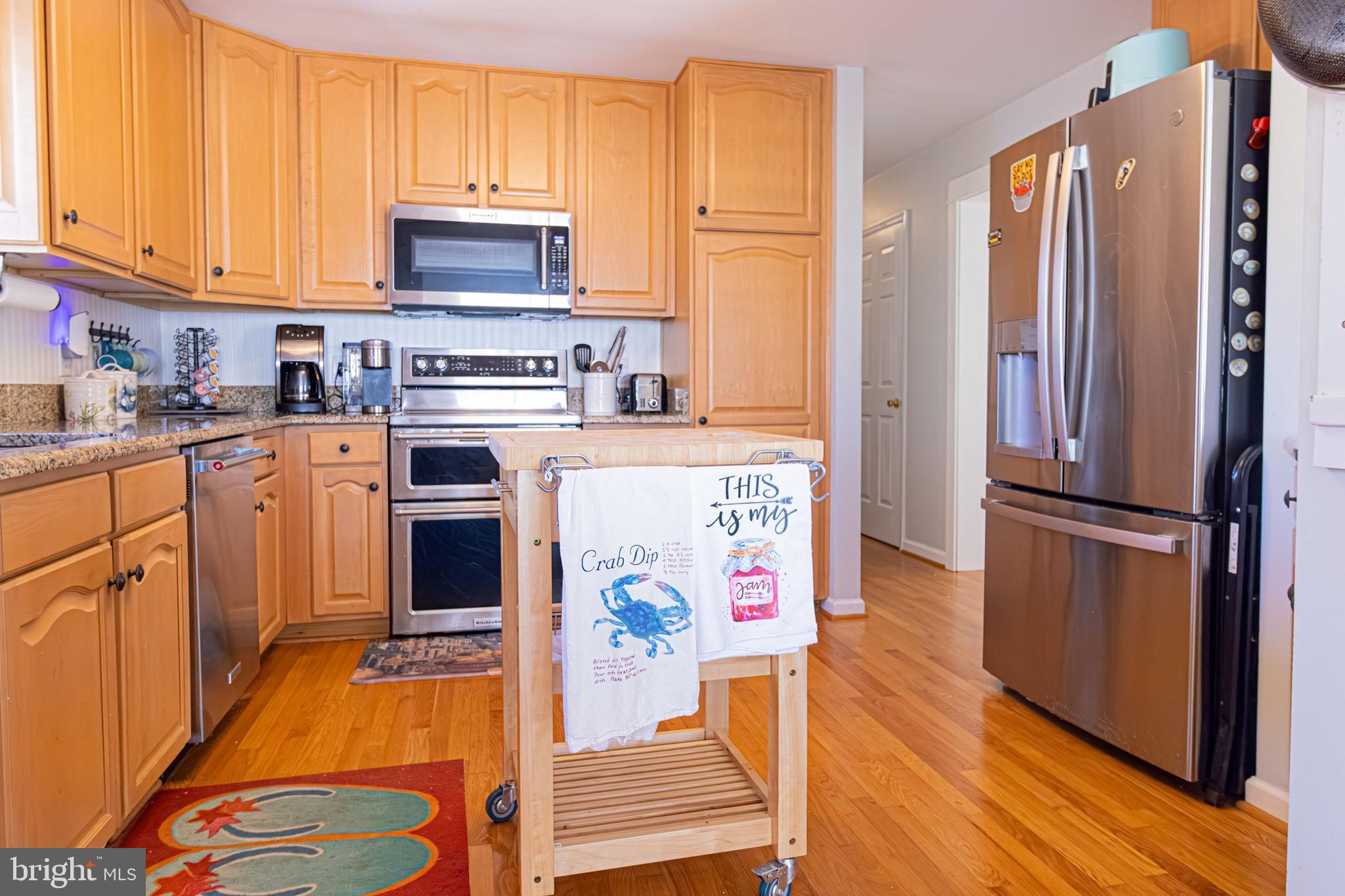 903 Oakdene Road Middle River, MD 21220 - Photo 47 of 47 a kitchen with stainless steel appliances a stove a refrigerator and a cabinets