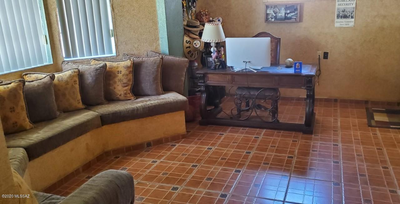 173 Nabo Court Rio Rico, AZ 85648 - Photo 13 of 26 a living room with furniture and a fireplace