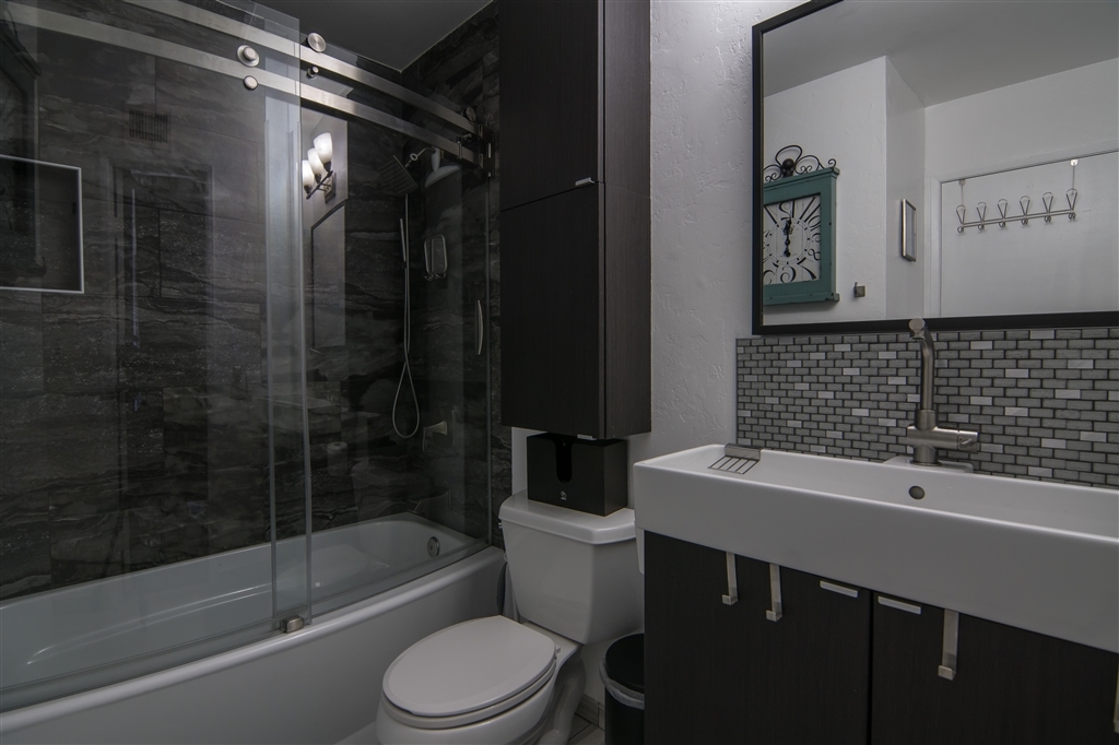 2230 Ledgeview Lane Spring Valley, CA 91977 - Photo 17 of 25 Upstairs bathroom remodeled, with curved contemporary doors and 2 niches