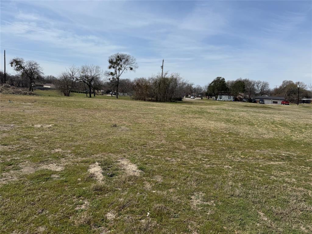 7945 White Settlement Road White Settlement, TX 76108 - Photo 18 of 19 a view of a field with an trees