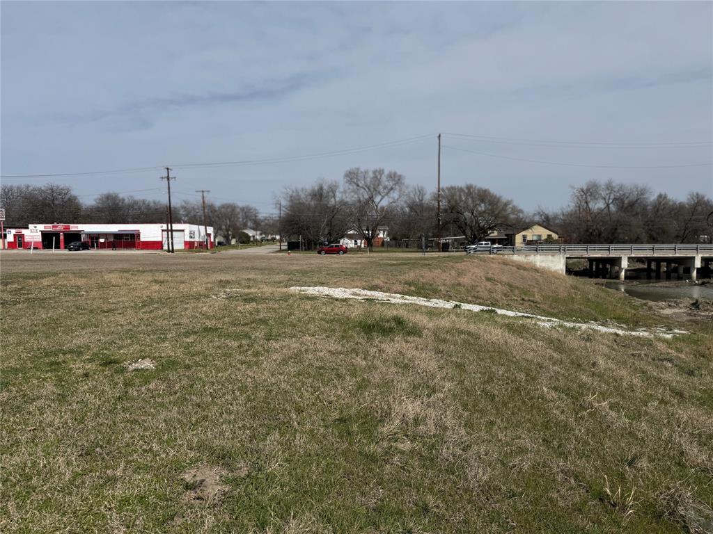 7945 White Settlement Road White Settlement, TX 76108 - Photo 10 of 19 a backyard of a house with table and chairs
