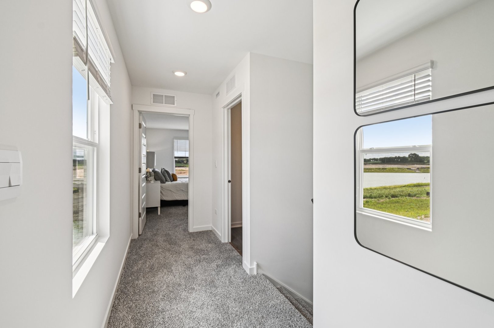 2417 Semillon Street Oswego, IL 60543 - Photo 17 of 45 a view of a hallway with a livingroom and a bathroom
