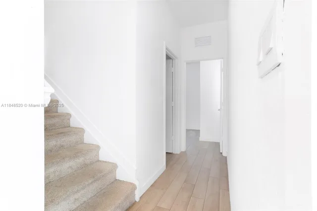 a view of a room that has a window in it