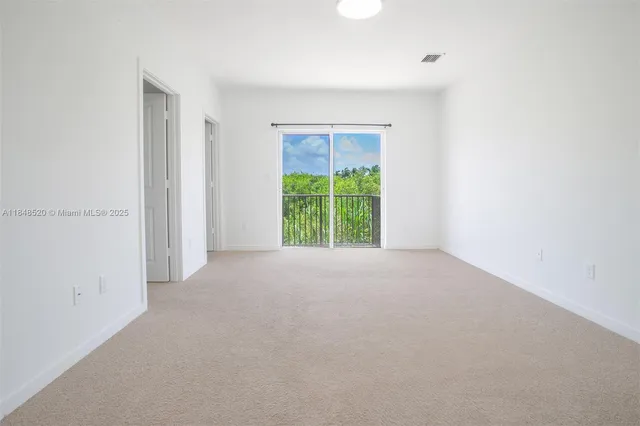 a view of a balcony with wooden fence
