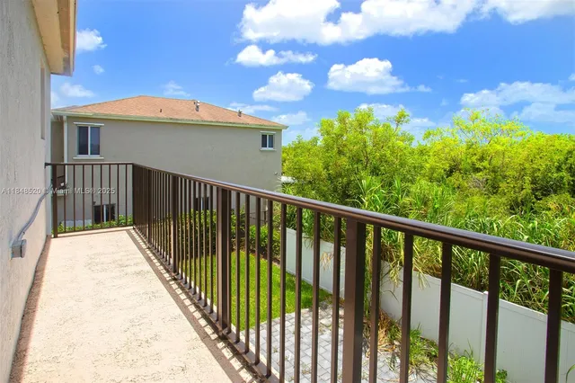 a bathroom with a double vanity sink a mirror and a bathtub