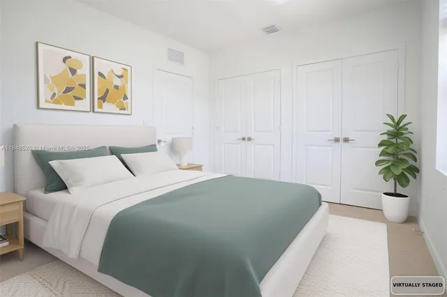 a large kitchen with stainless steel appliances a refrigerator a stove top oven a sink and dishwasher