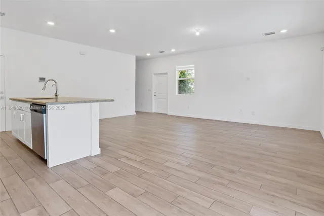 a view of a kitchen with a sink and a stove