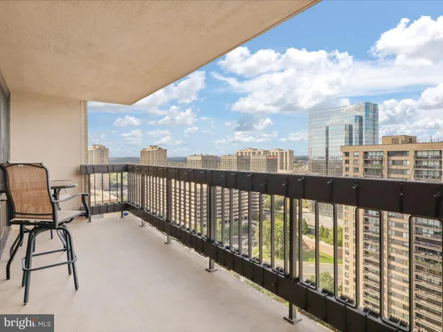 a view of a balcony with chairs