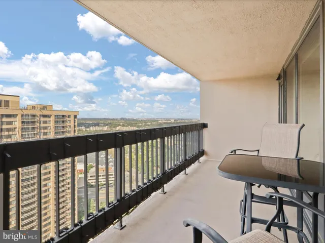 a view of parking garage with cars parked