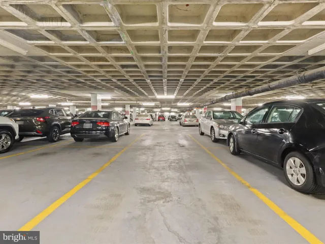 a view of parking garage with cars