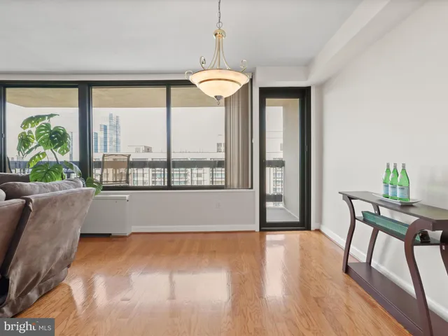 a view of a room with furniture and a large window
