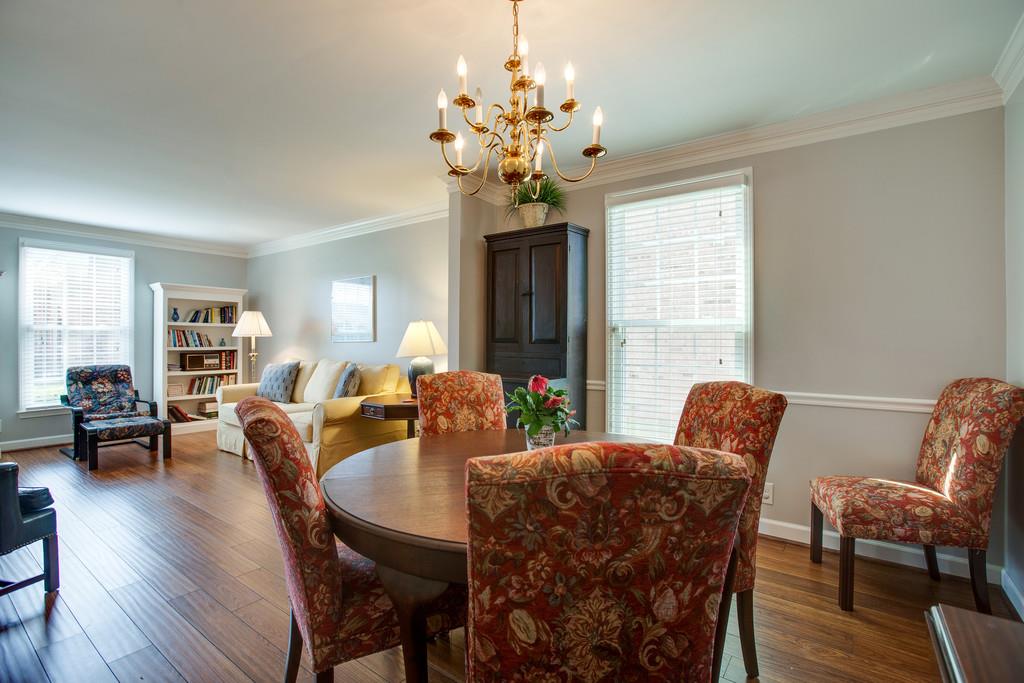 1250 General George Patton Road Nashville, TN 37221 - Photo 8 of 27 a view of a dining room with furniture window and wooden floor