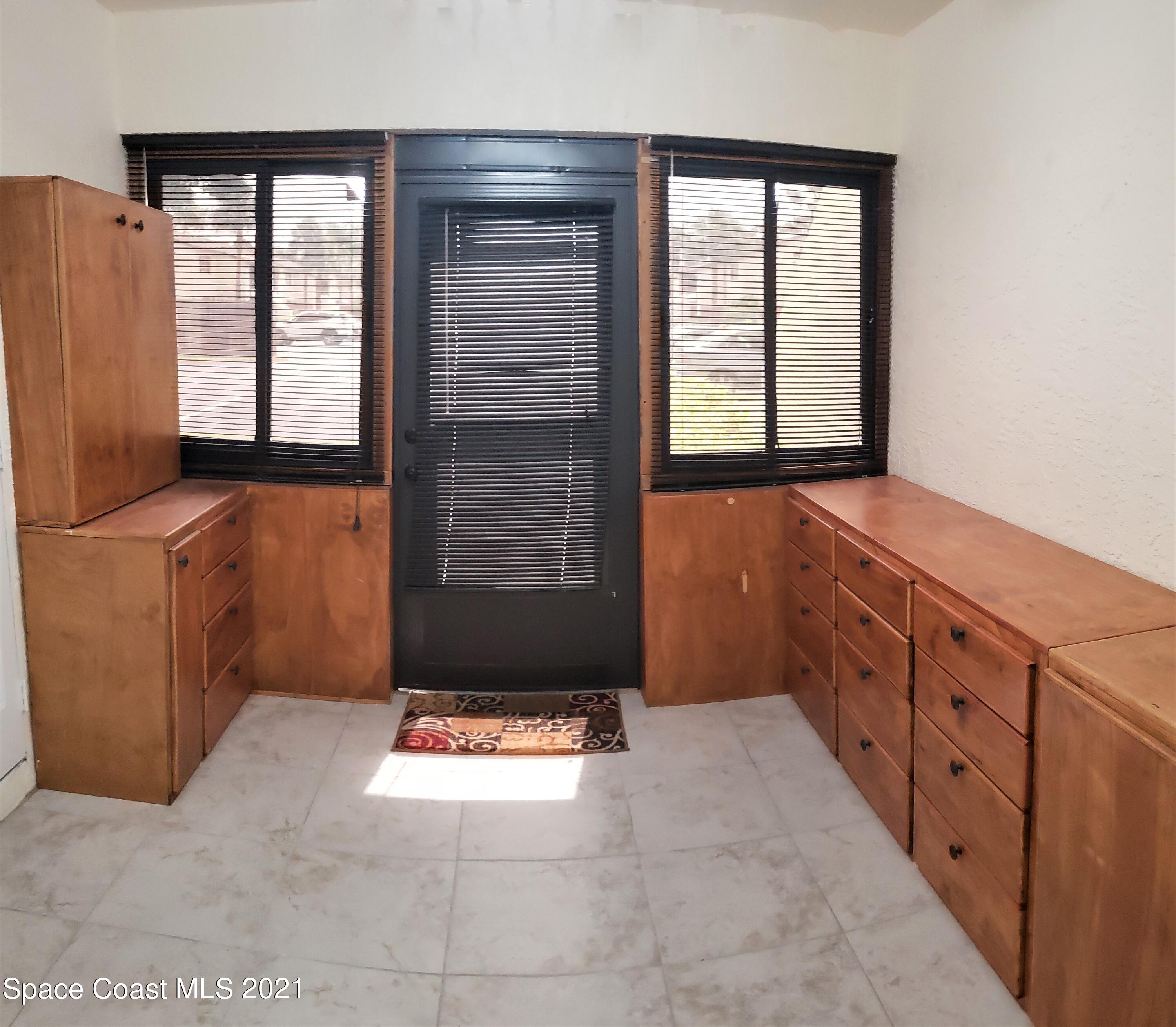 653 Ridge Club Drive, Unit 27 Melbourne, FL 32934 - Photo 21 of 31 Sun Room Entry