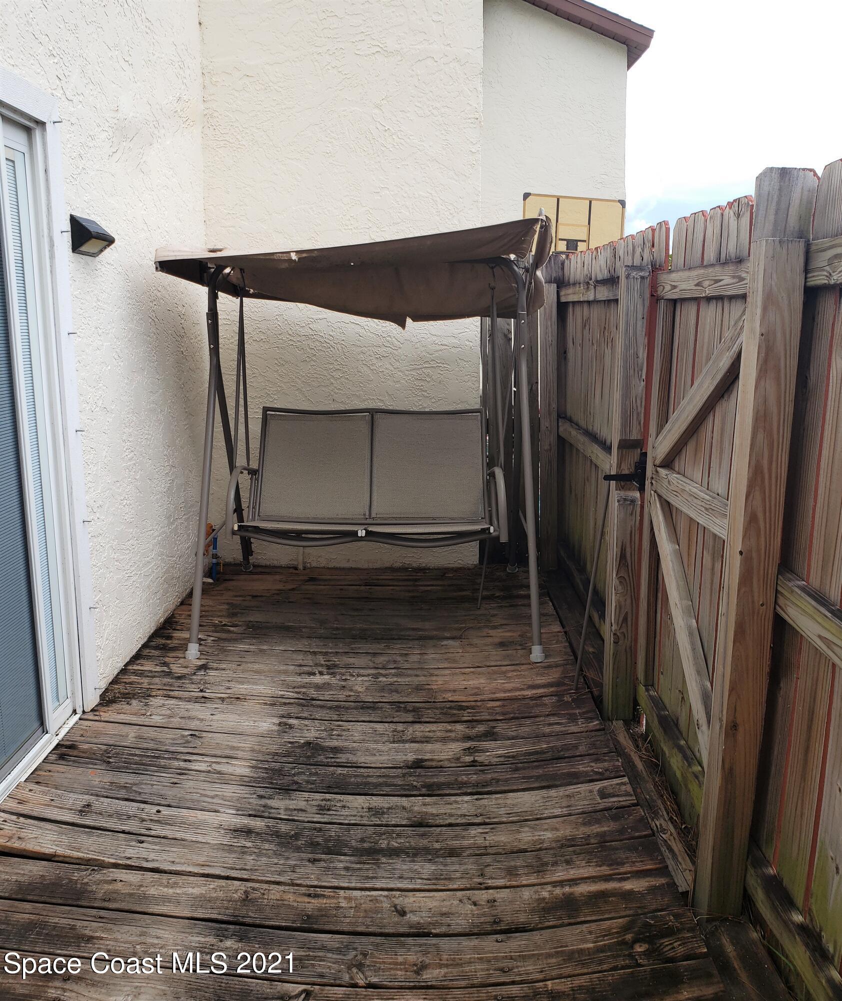 653 Ridge Club Drive, Unit 27 Melbourne, FL 32934 - Photo 24 of 31 Fenced_-In Deck