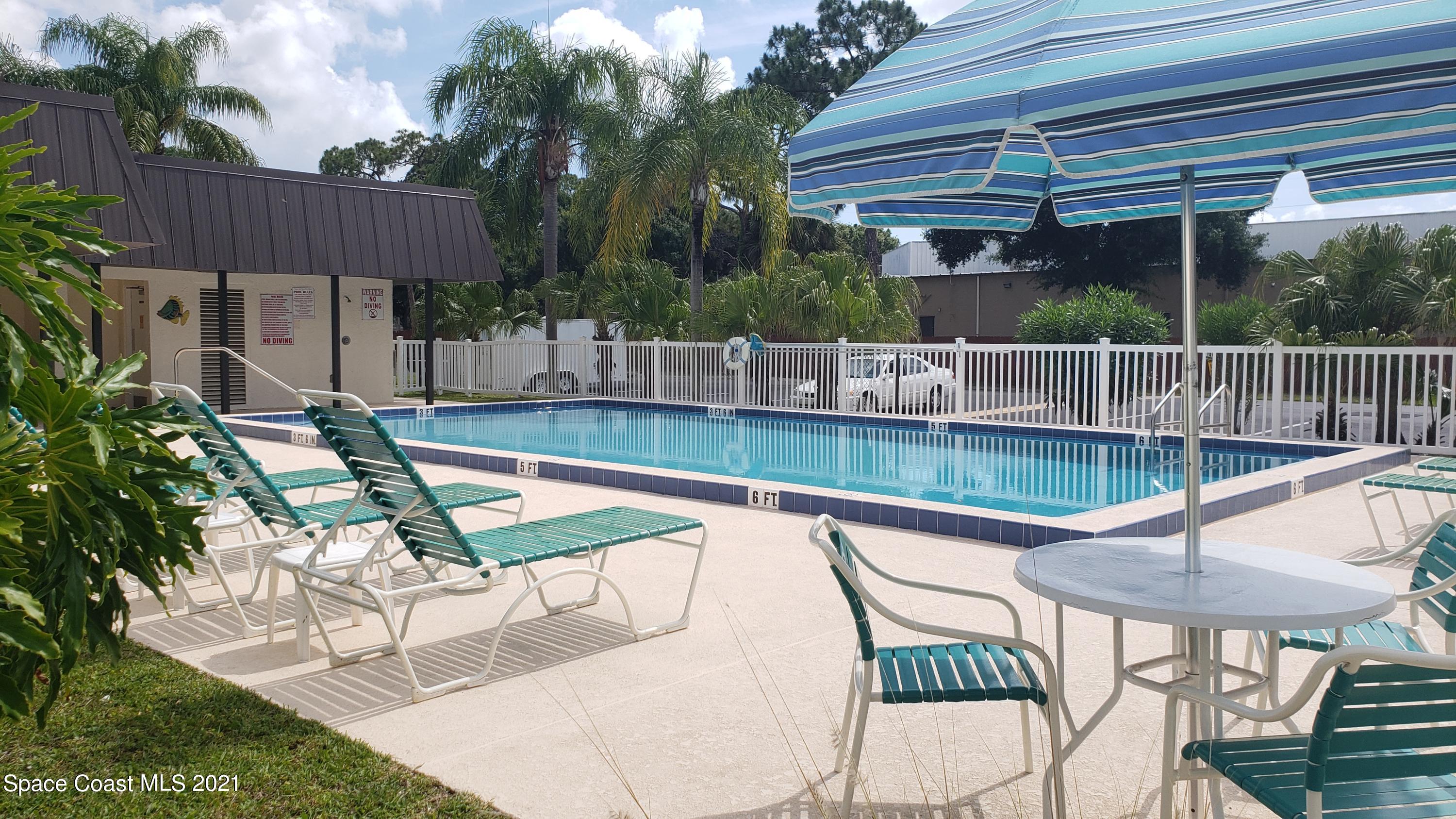 653 Ridge Club Drive, Unit 27 Melbourne, FL 32934 - Photo 27 of 31 Pool Area