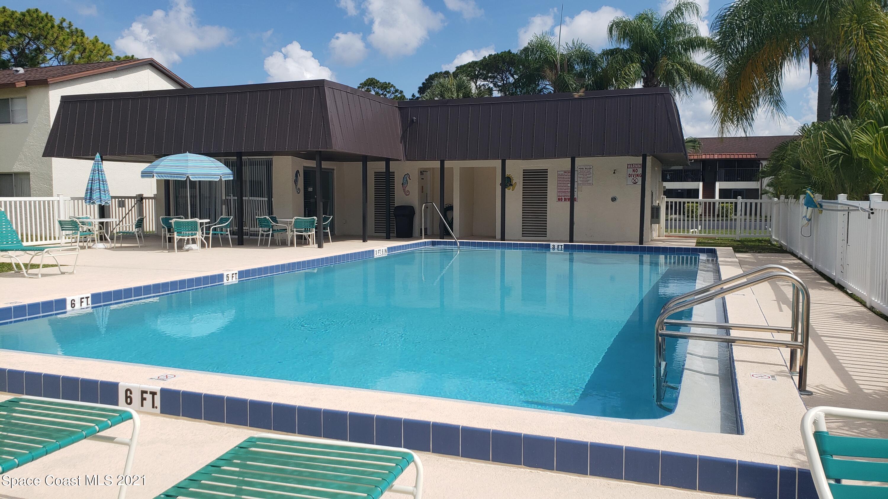 653 Ridge Club Drive, Unit 27 Melbourne, FL 32934 - Photo 28 of 31 Pool &_Clubhouse