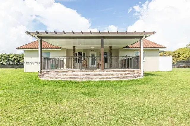 a view of a white building with a outdoor space