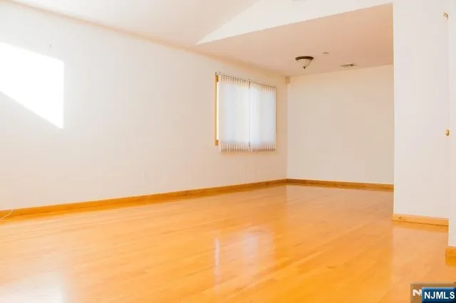 a view of a house with a wooden deck