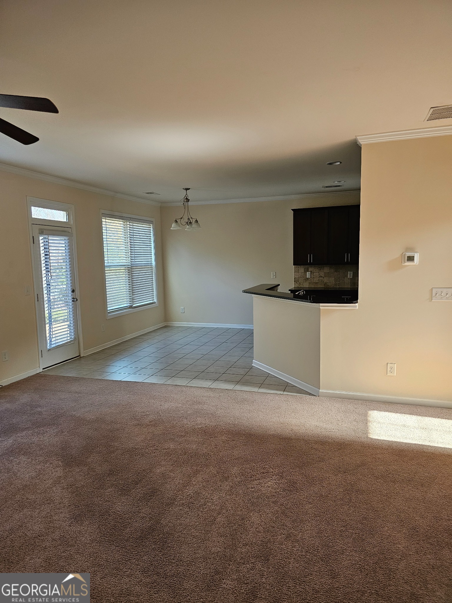 6509 Panasa Court Norcross, GA 30093 - Photo 14 of 16 a view of a livingroom with an empty space and a fireplace
