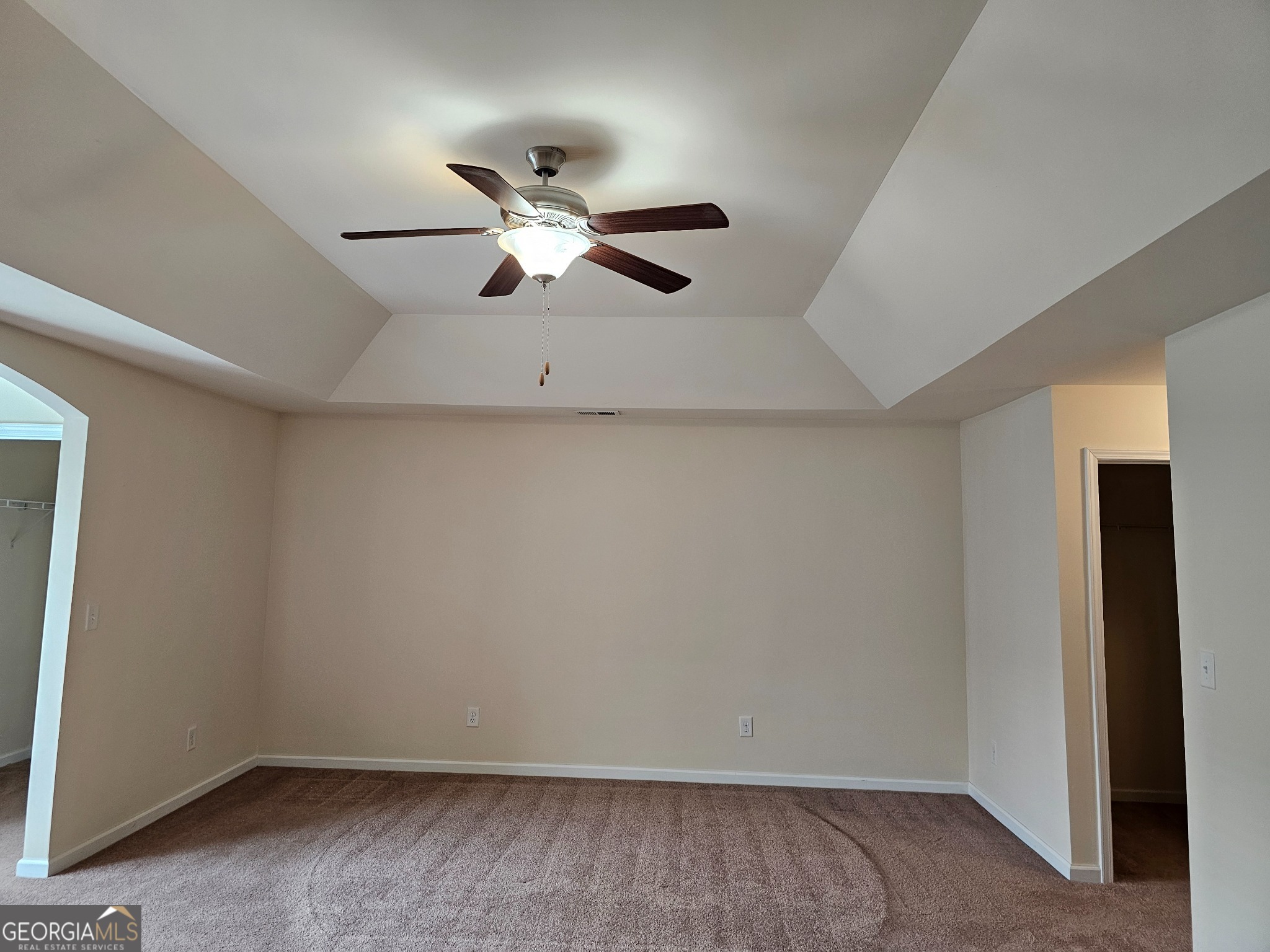 6509 Panasa Court Norcross, GA 30093 - Photo 6 of 16 an empty room with a window and a ceiling fan