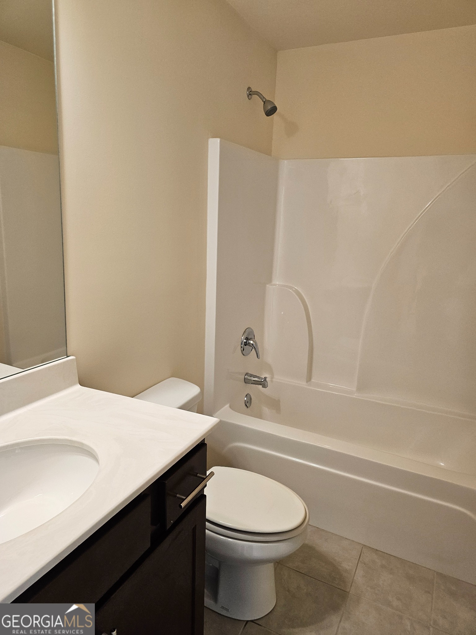 6509 Panasa Court Norcross, GA 30093 - Photo 9 of 16 a bathroom with a sink a toilet and shower