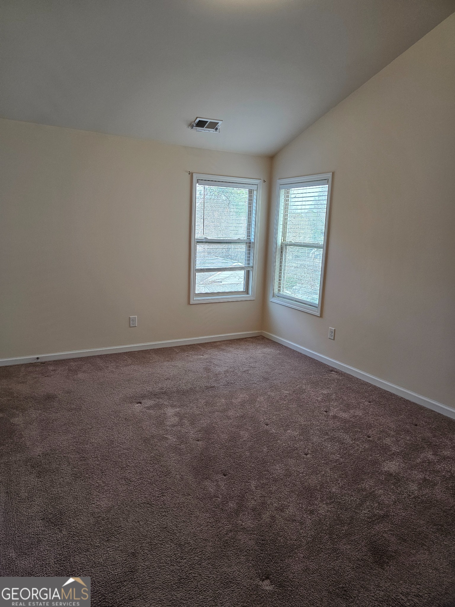 6509 Panasa Court Norcross, GA 30093 - Photo 10 of 16 an empty room with a window