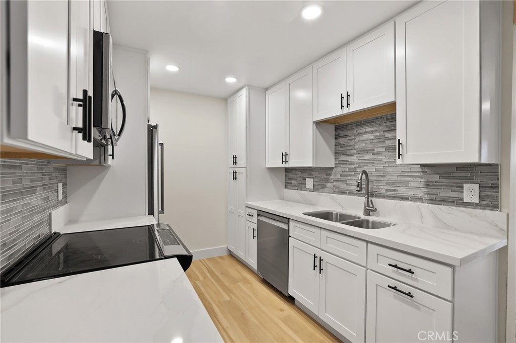 25611 Quail Run, Unit 63 Dana Point, CA 92629 - Photo 13 of 22 a kitchen with a sink appliances and cabinets