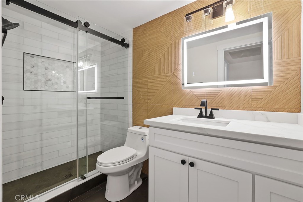 25611 Quail Run, Unit 63 Dana Point, CA 92629 - Photo 19 of 22 a bathroom with a sink a toilet and shower