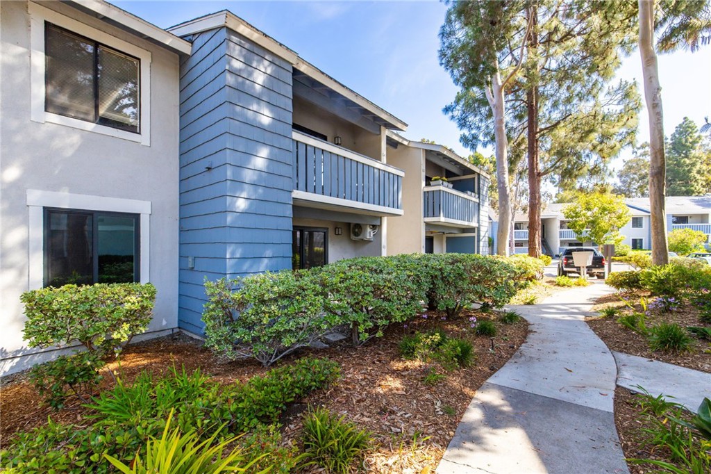 25611 Quail Run, Unit 63 Dana Point, CA 92629 - Photo 2 of 22 a view of a brick building next to a yard