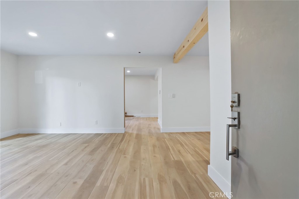 25611 Quail Run, Unit 63 Dana Point, CA 92629 - Photo 6 of 22 a view of empty room with wooden floor