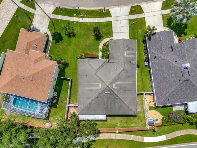 an aerial view of a pool patio swimming pool and outdoor seating