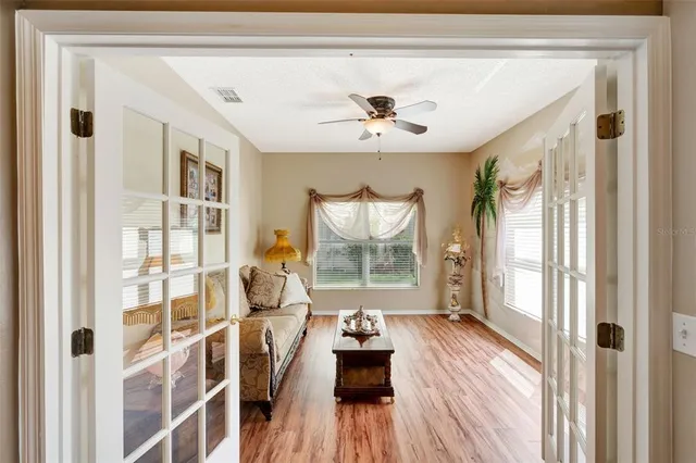 a living room with furniture and a large window