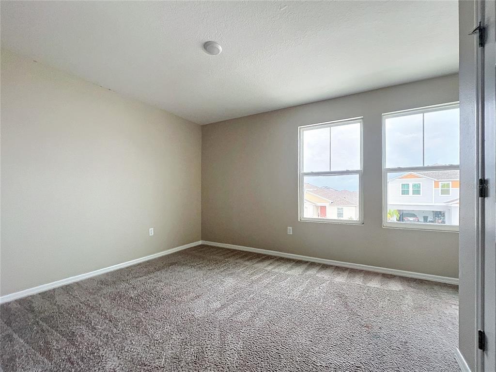 1404 Axel Circle Winter Haven, FL 33880 - Photo 11 of 21 an empty room with windows