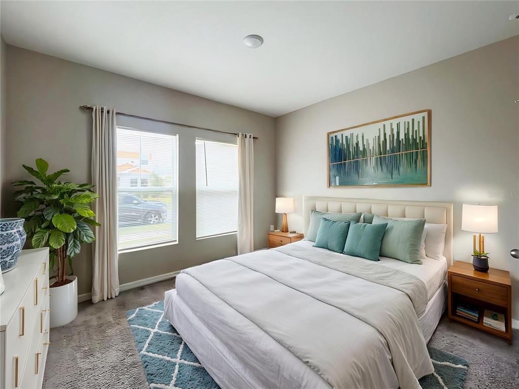 1404 Axel Circle Winter Haven, FL 33880 - Photo 12 of 21 a bedroom with a large bed and a window