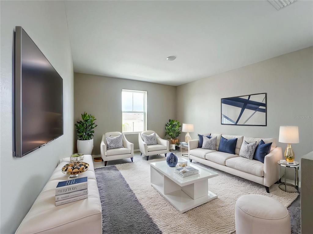 1404 Axel Circle Winter Haven, FL 33880 - Photo 14 of 21 a living room with furniture and a large window