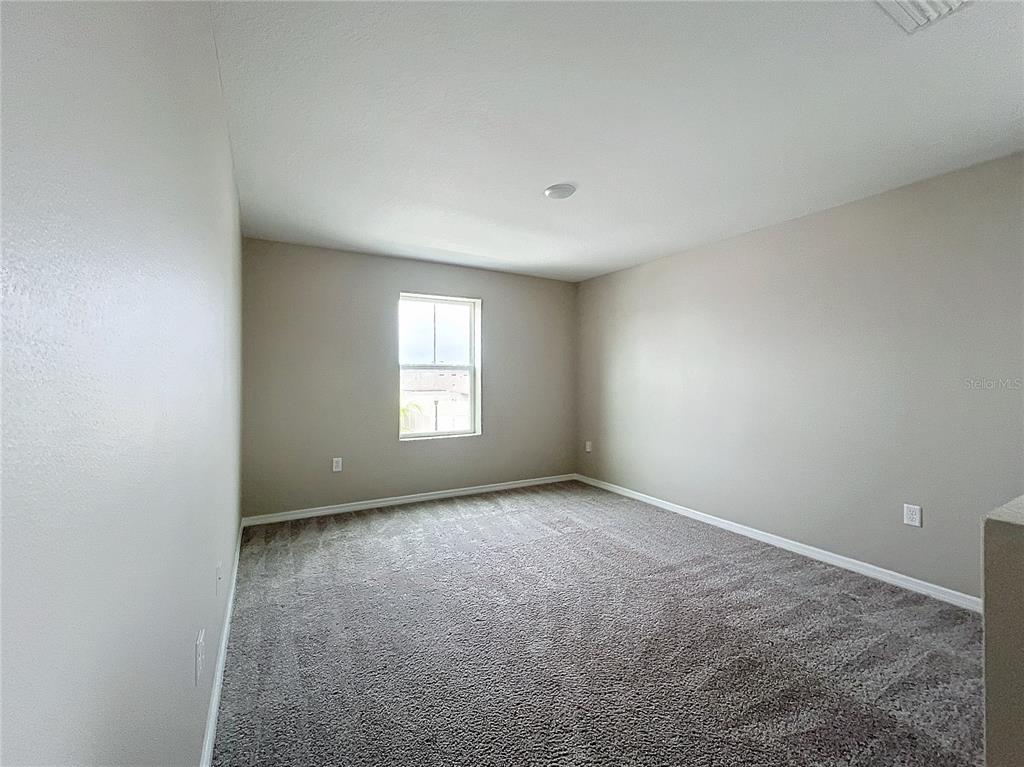 1404 Axel Circle Winter Haven, FL 33880 - Photo 15 of 21 an empty room with windows